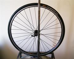 Continental Grand Prix Continental Grand Prix road bike tire on a rolling resistance test machine