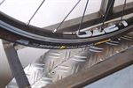 Continental Grand Prix 4 Season Continental Grand Prix 4 Season road bike tire on a rolling resistance test machine