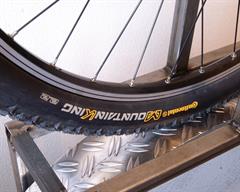 Continental Mountain King II RaceSport Continental Mountain King II RaceSport mountain bike tire on a rolling resistance test machine