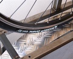 Michelin Dynamic Sport Michelin Dynamic Sport road bike tire on a rolling resistance test machine