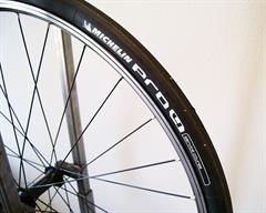 Michelin Pro 4 Service Course Michelin Pro 4 Service Course road bike tire on a rolling resistance test machine