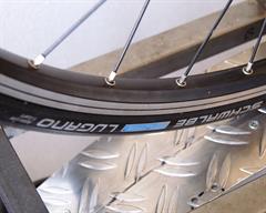 Schwalbe Lugano Schwalbe Lugano road bike tire on a rolling resistance test machine