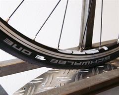 Schwalbe One V-Guard Schwalbe One V-Guard road bike tire on a rolling resistance test machine