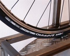 Vittoria Zaffiro Slick Vittoria Zaffiro Slick road bike tire on a rolling resistance test machine