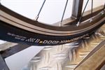 Continental Grand Prix 4000S II Continental Grand Prix 4000S II road bike tire on a rolling resistance test machine
