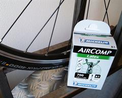 Continental Grand Prix 4000S II Latex Tube Continental Grand Prix 4000S II Latex Tube road bike tire on a rolling resistance test machine