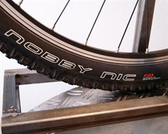 Schwalbe Nobby Nic Performance Schwalbe Nobby Nic Performance mountain bike tire on a rolling resistance test machine